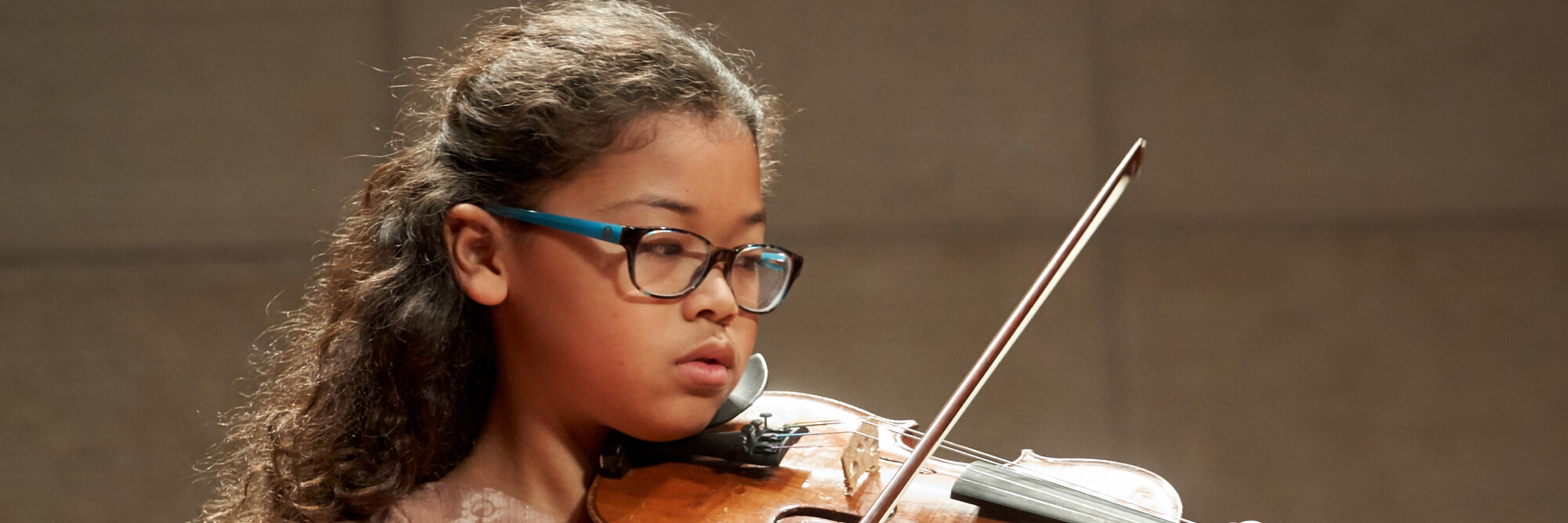 Pre-College student playing violin