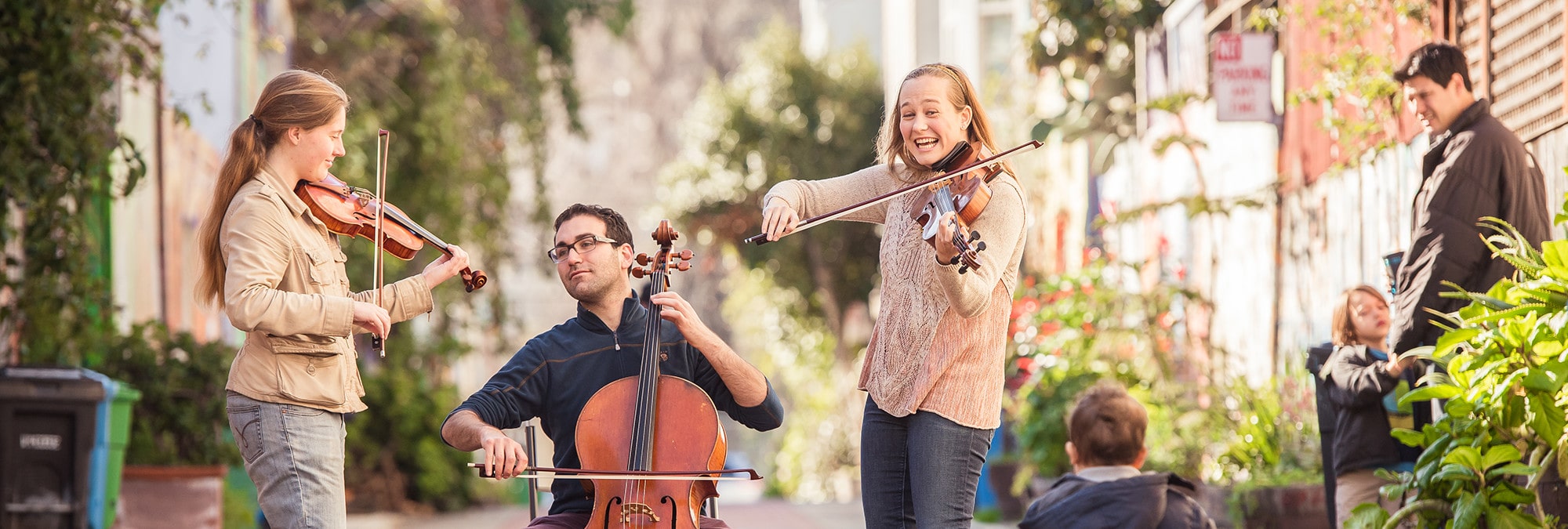 String Trio playing outside violin viola cello