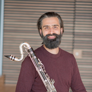 jeff anderle holding a bass clarinet