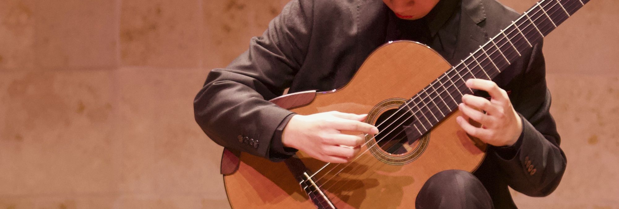 A San Francisco Conservatory of Music student playing the guitar