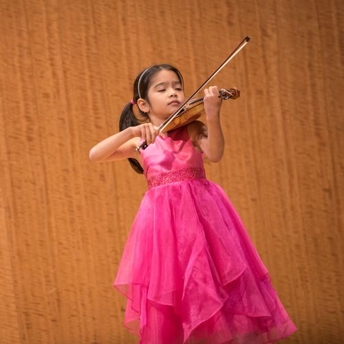 a young violinist performing