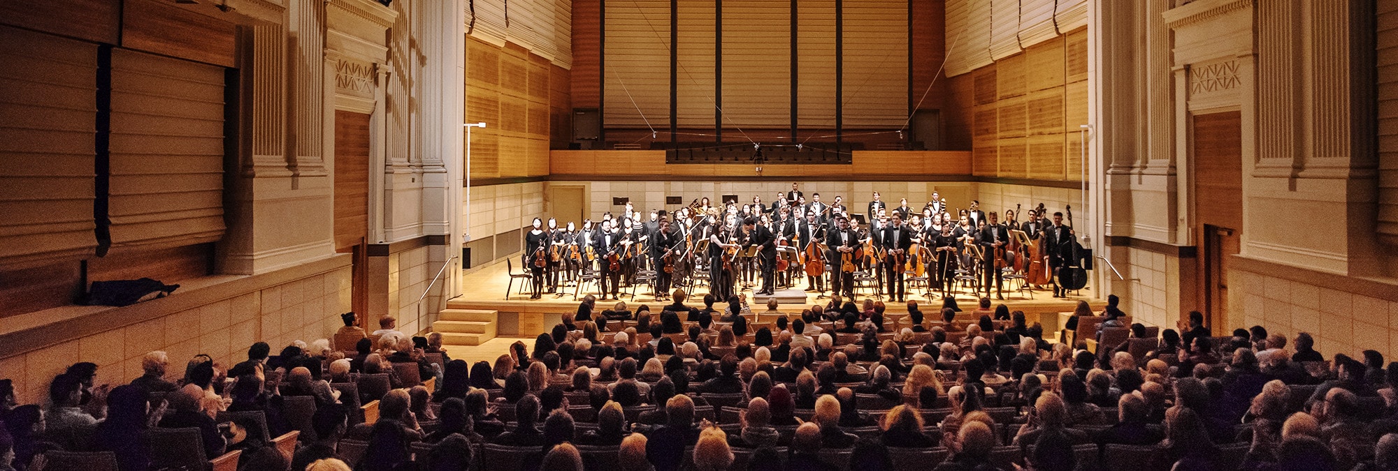 Caroline H. Hume Concert Hall performance orchestra full house wide panoramic