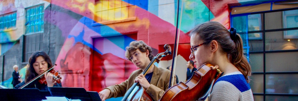 SFCM Students Performing in front of Hickory Alley Mural 