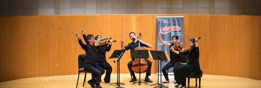 A quartet of students and faculty performing