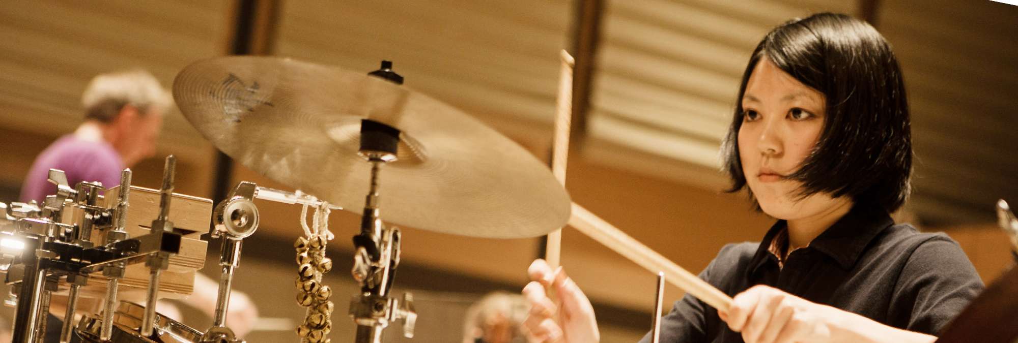 close up of a drum kit and a cymbal about the be struck