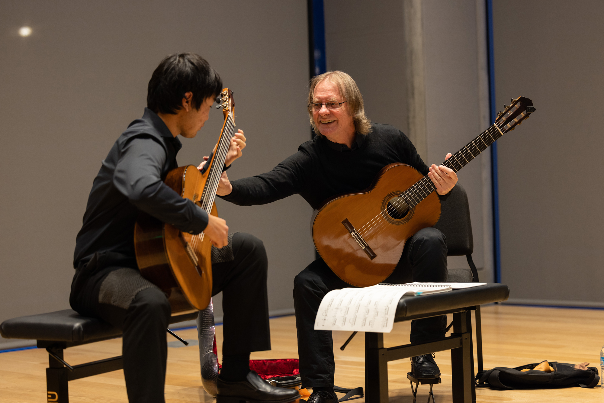 David Russell Teaches a student in a masterclass setting