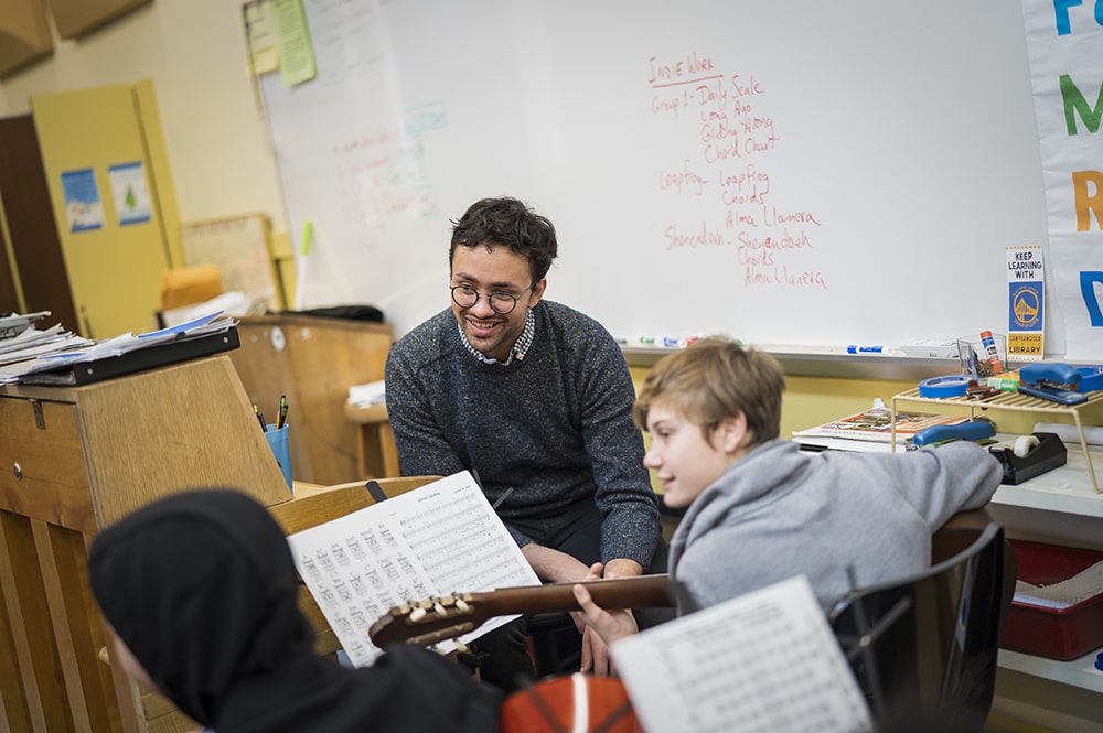 CIS Conservatory in the Schools Presidio Middle Schools Abshir Miller guitarist teaching students