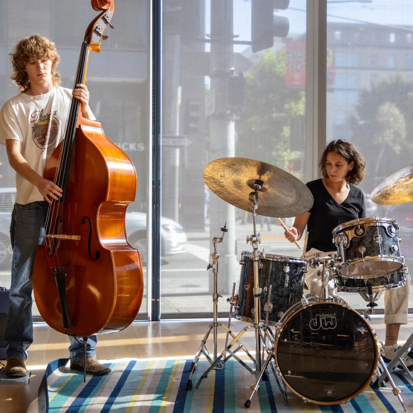 Bassist and drummer jamming.