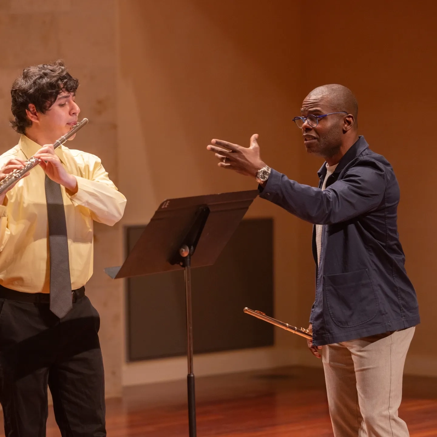 Flute player next to director