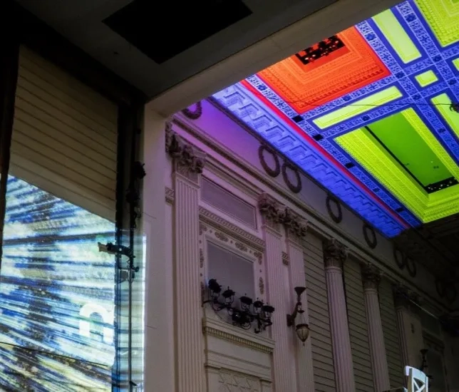 The concert hall lit up by different colors and projections