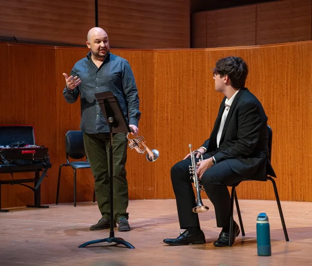 Esteban Batallán works with student Jordan Ku.