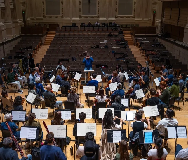 Students and SFBO musicians play in the Caroline H. Hume Concert Hall. 