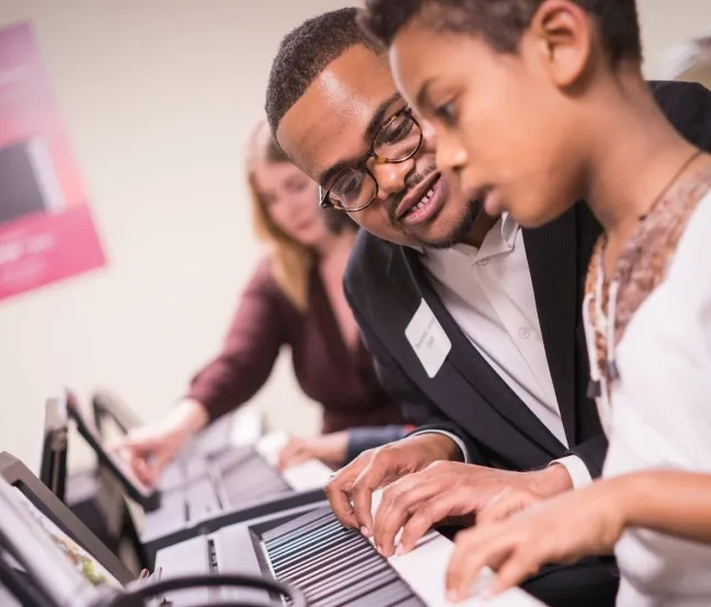SFCM student working with Junior High Student in BAM program