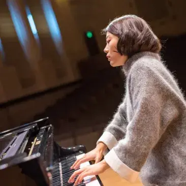 a pianist plays expressively in hume concert hall