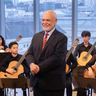 Scott Cmiel with the Pre-College Guitar Ensemble.