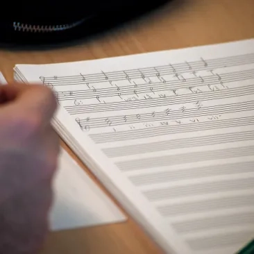A music student works on theory and composition.