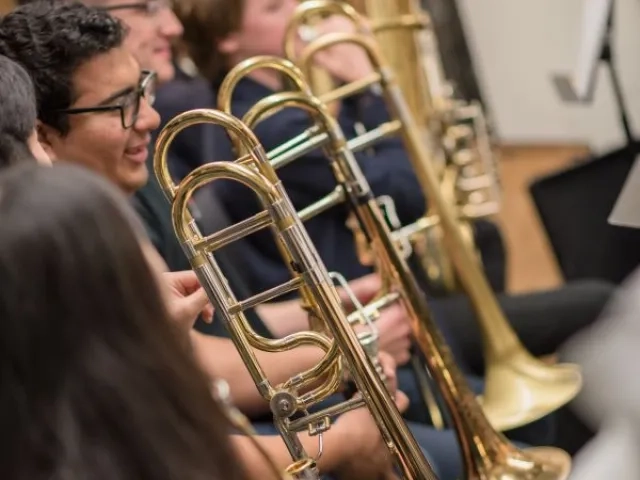 the trombone section during rehearsal