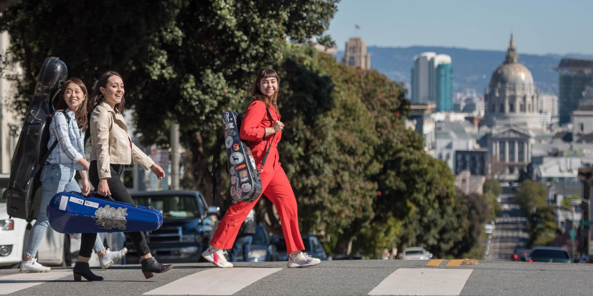 Conservatory students - string quintet crossing the road