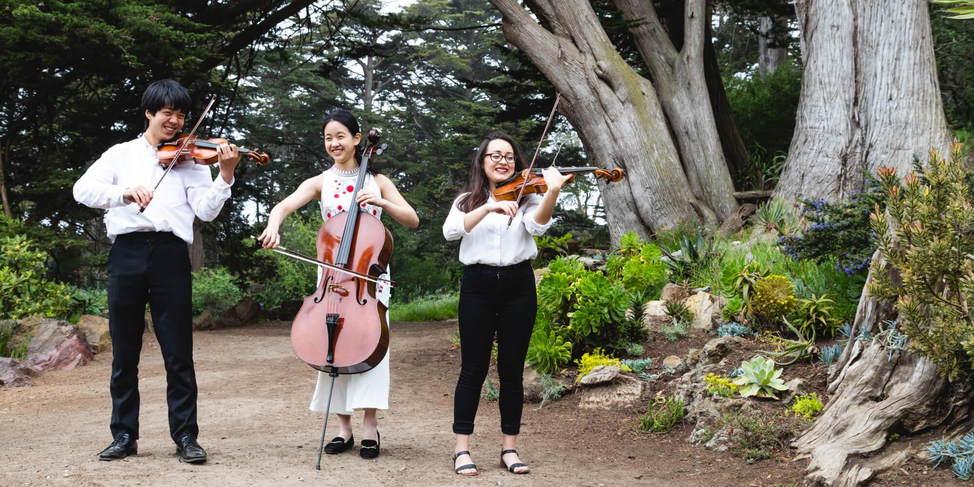 Conservatory students playing music in the park