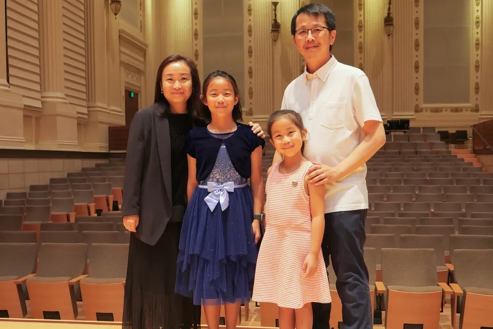 Christina and Clifford Shih with their daughters (L-R) Claire and Chloe.