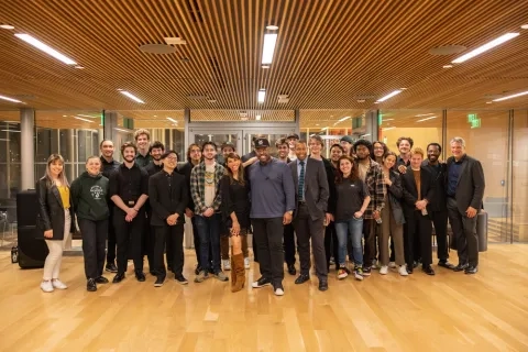a group photo of rjam students with christian mcbride and lara downes