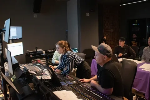 TAC students and members from Sony sit in the studio 
