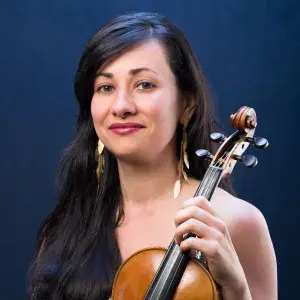 Natasha Makhijani Headshot with instrument