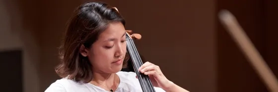 Student playing a cello