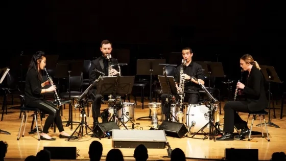 four clarinetists perform a piece
