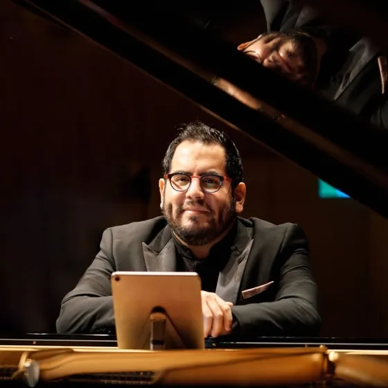 julio elizalde at the piano