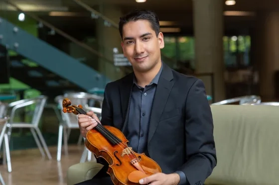Daniel Dastoor with the 1700 Stradivarius on loan from the Canada Council for the Arts.