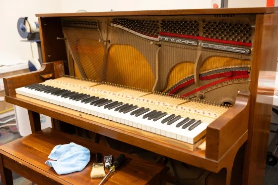 A Steinway upright being repaired.
