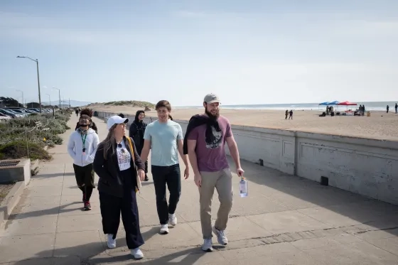 SFCM students hiking along the coastline.