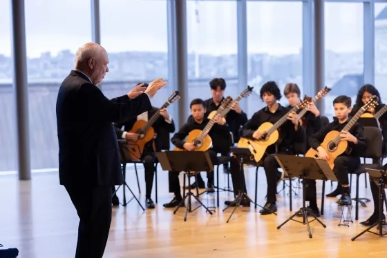 Scott Cmiel with the Pre-College Guitar Ensemble.