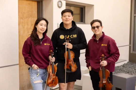 Students Ruby Ro, Harry Wang, Aleksi Zaretsky.
