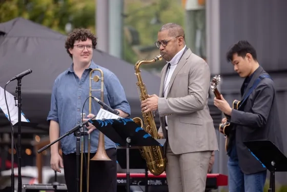 Graham Houpt and Trí Pham perform with faculty Jason Hainsworth.