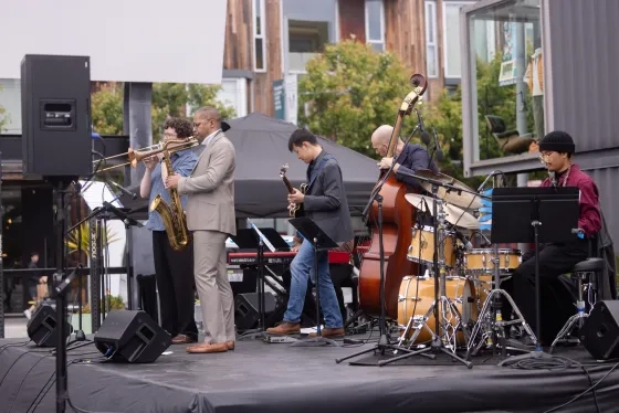 RJAM's Jason Hainsworth and Matt Brewer play side-by-side with students. 