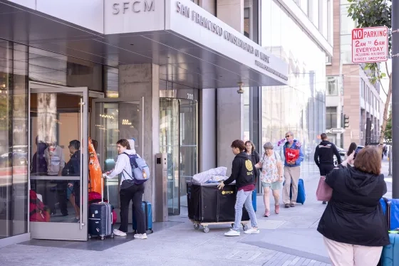 Students move into the Bowes Center. 