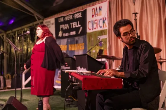 Students Cat Hill (left) and Emmett Van Leer (piano) perform at the 2025 Light in the Grove gala (Credit: Onyx & Ash Photography).