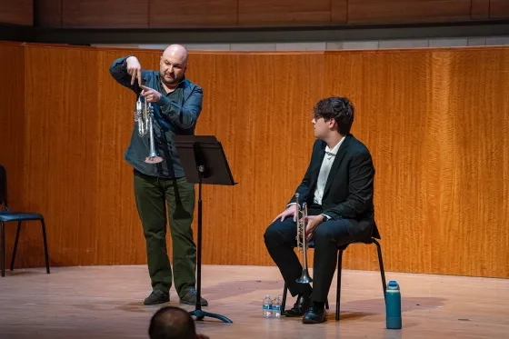 Esteban Batallán works with student Jordan Ku.