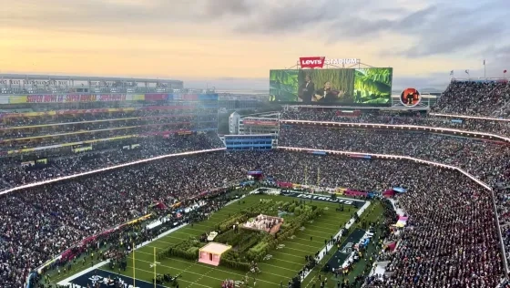 Crelli seen on the jumbotron during the halftime performance. 