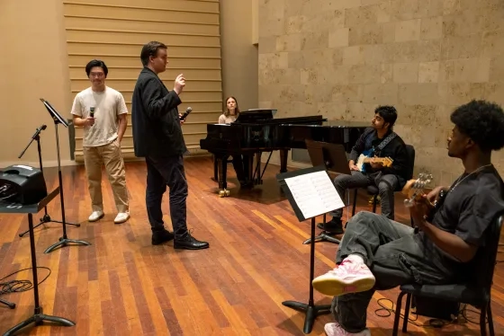 Olivia Flanigan (seated) and her Contemporary Vocal Craft class.