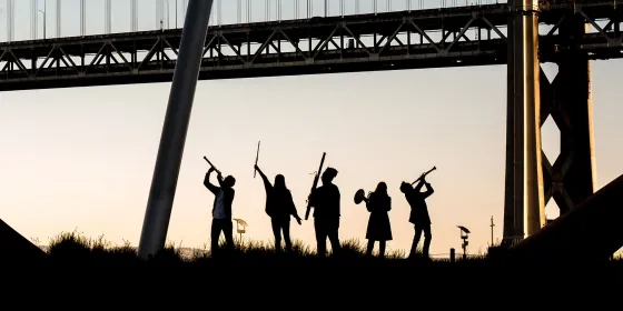 A photo of students by the Bay Bridge