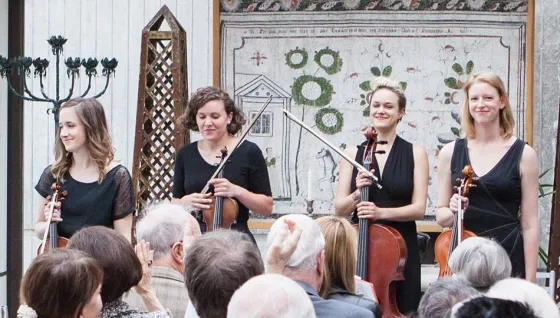 String musicians in front of audience