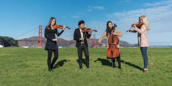 String Quartet playing in front of Golden Gate Bridge