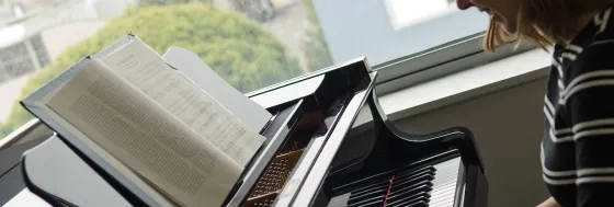 picture of a keyboard and a practice room window 