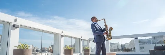 Jason Hainsworth playing Saxophone outside