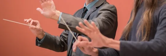 student in a conducting lesson with a professor