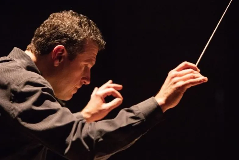 Curt Pajer conducting an opera in the dark