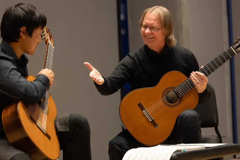 David Russell (right) with an SFCM guitarist.